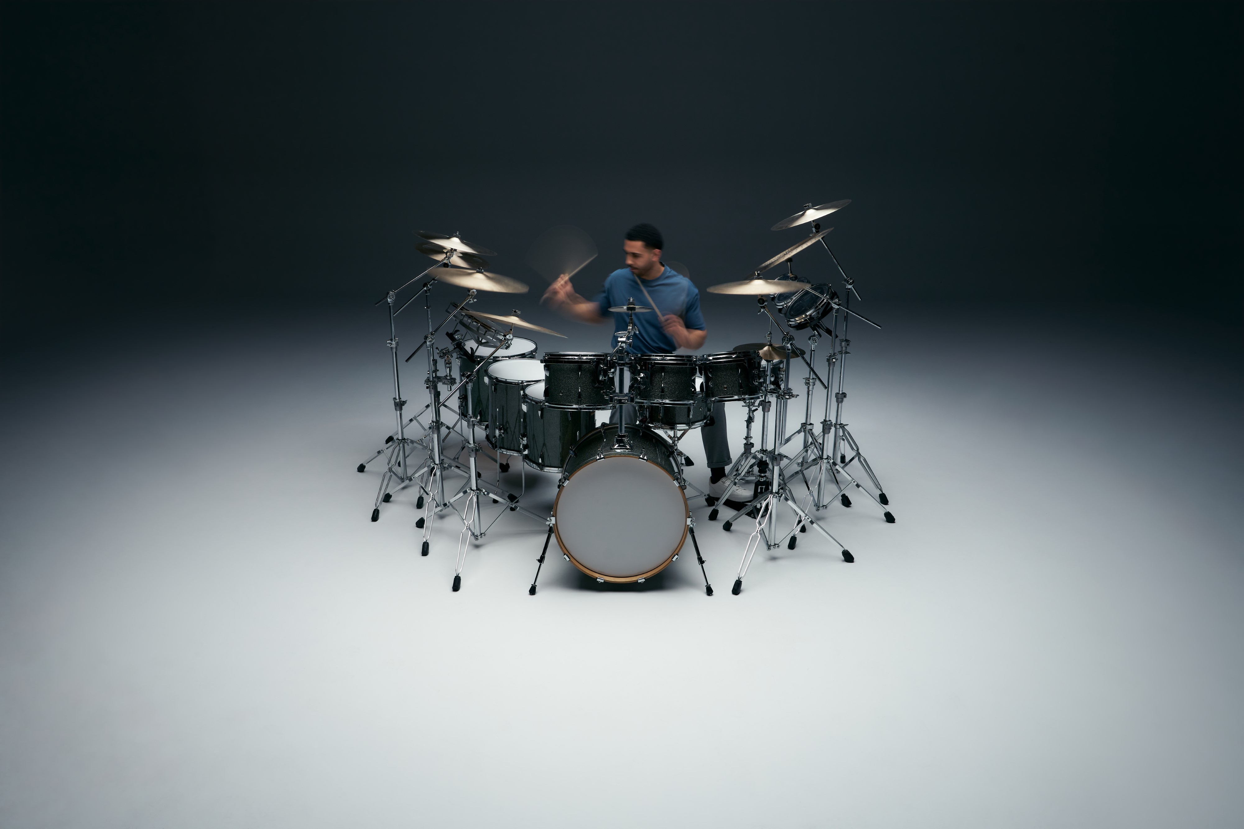 Drummer playing on a drum kit